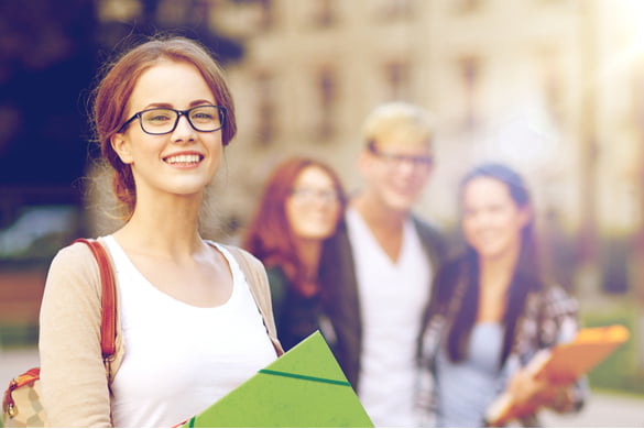 female student with group of friends in background