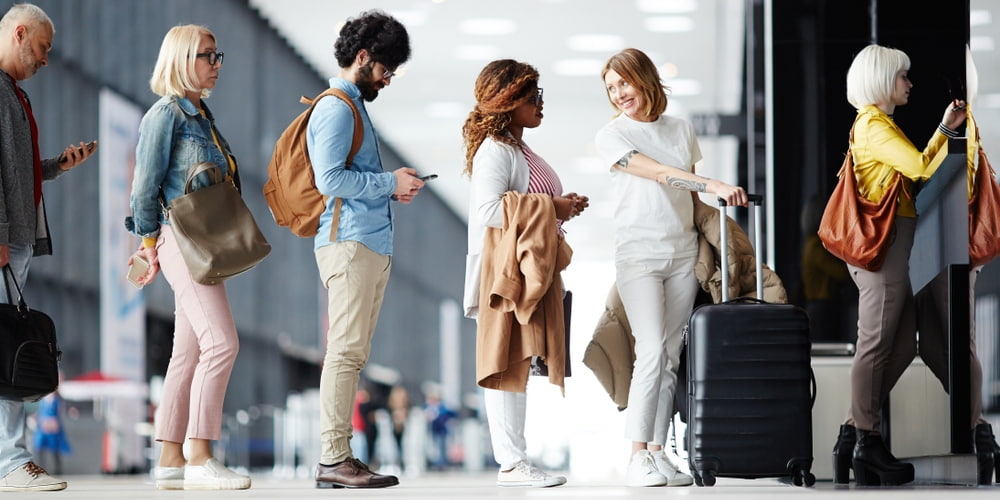 airport passengers stand in line to board their flight in Austin