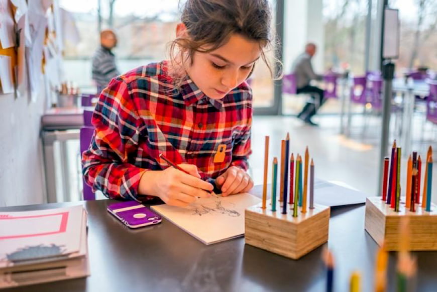 a girl explores an interactive museum exhibit